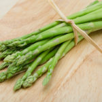 38032350 - fresh raw green asparagus on the wood background